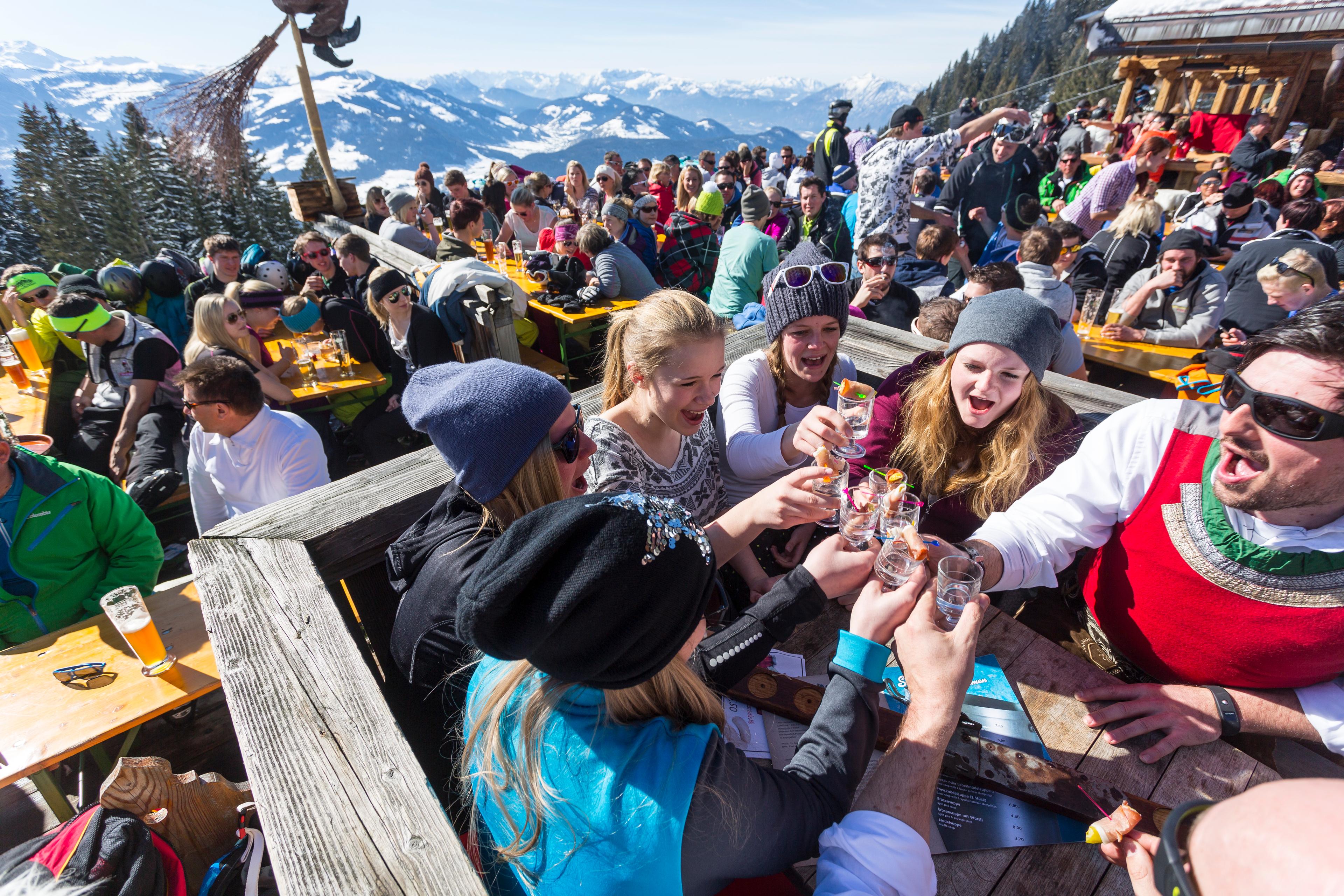 Friends enjoying a schnapps at Austrian Apres Ski Party in Solden